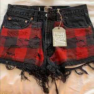 Black vintage Levi shorts with plaid detail. NEW